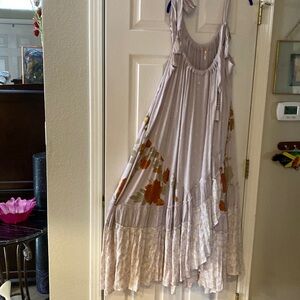 Free people maxi dress size large. Never worn and ready for the right owner.